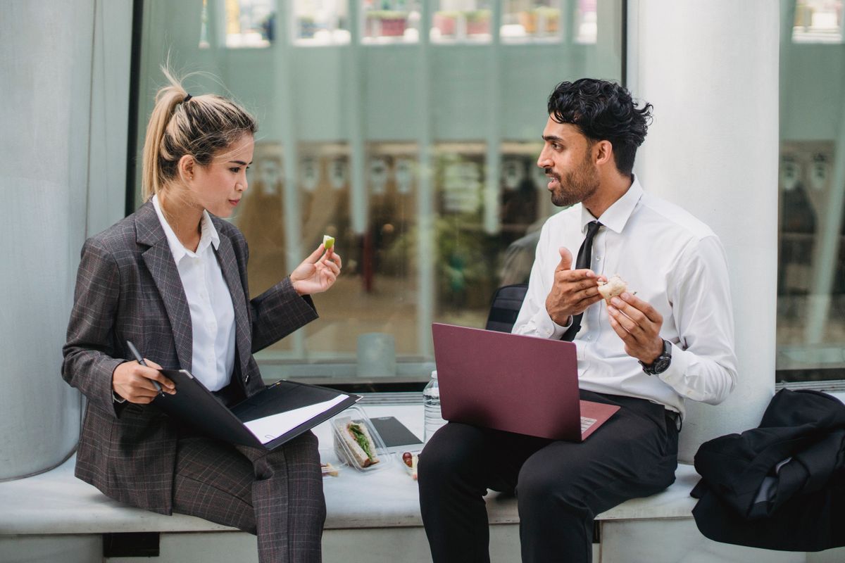 Customer support assistant at a laptop